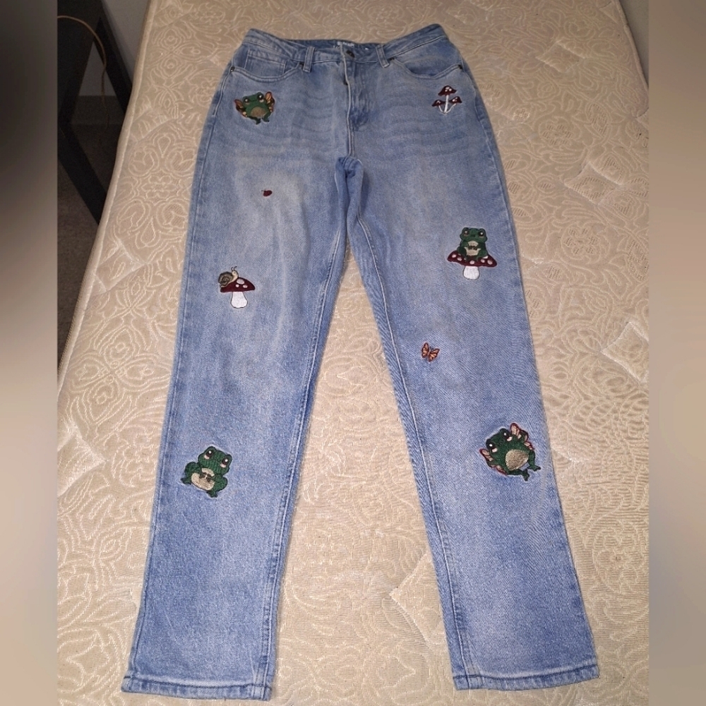 HT Denim Mom Jean in a size 7. It features Pixies, mushrooms, and ladybugs